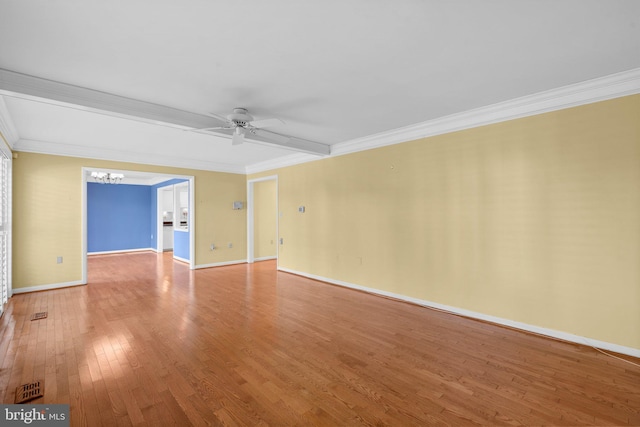unfurnished room featuring baseboards, ornamental molding, wood finished floors, and ceiling fan with notable chandelier