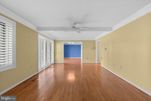 unfurnished room with visible vents, ornamental molding, wood finished floors, baseboards, and ceiling fan with notable chandelier