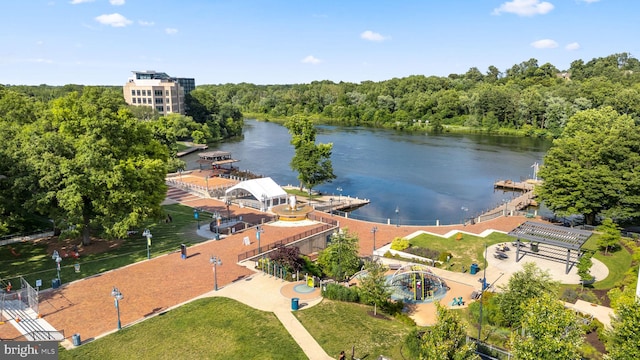 drone / aerial view featuring a water view and a view of trees