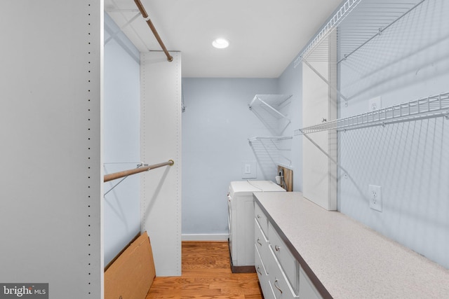 spacious closet featuring light wood-style flooring