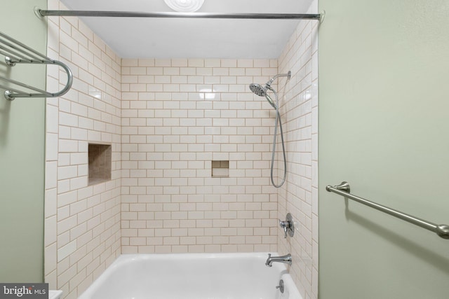 bathroom with shower / washtub combination