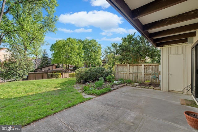 view of yard with a patio and fence