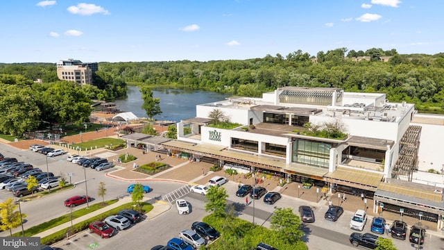 bird's eye view with a water view and a forest view