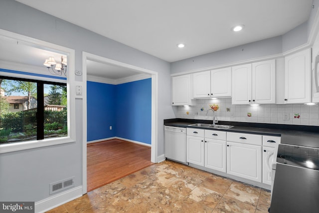 kitchen featuring visible vents, white cabinets, a sink, dishwasher, and range with electric cooktop