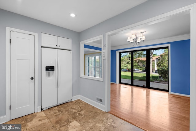 foyer with recessed lighting, baseboards, a notable chandelier, and visible vents