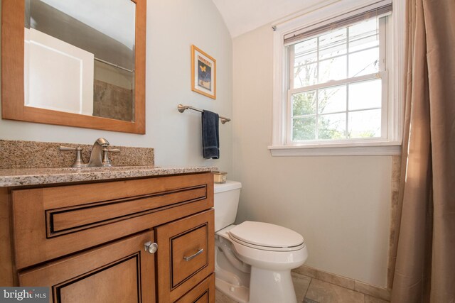 3004 Joshua Rd, Lafayette Hill, PA 19444 - full bathroom with vanity, curtained shower, toilet, tile patterned floors, and vaulted ceiling