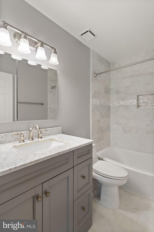 5811 Summerlake Way, Centreville, VA 20120 - full bathroom featuring visible vents, vanity, marble finish floor, toilet, and shower / washtub combination