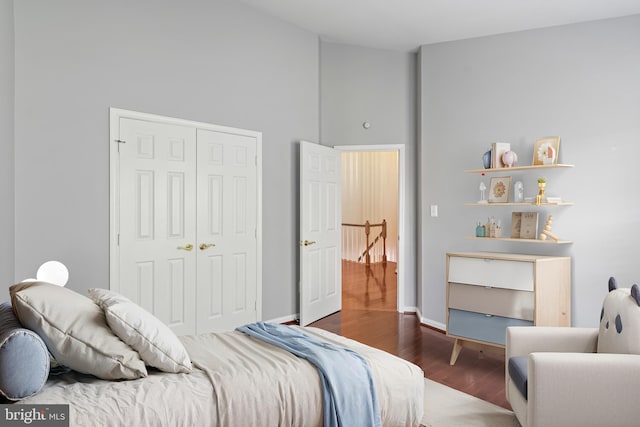 5811 Summerlake Way, Centreville, VA 20120 - bedroom featuring a closet, baseboards, wood finished floors, and high vaulted ceiling