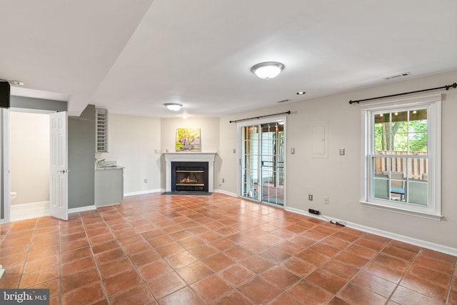 5811 Summerlake Way, Centreville, VA 20120 - unfurnished living room with baseboards, a fireplace with flush hearth, and tile patterned flooring
