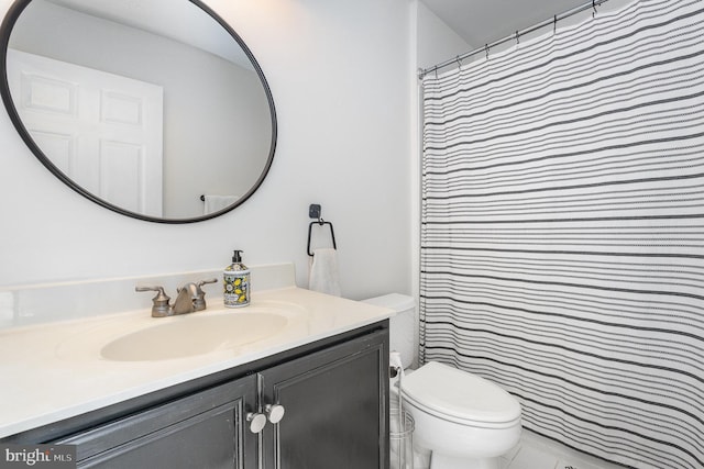 full bath featuring vanity and toilet