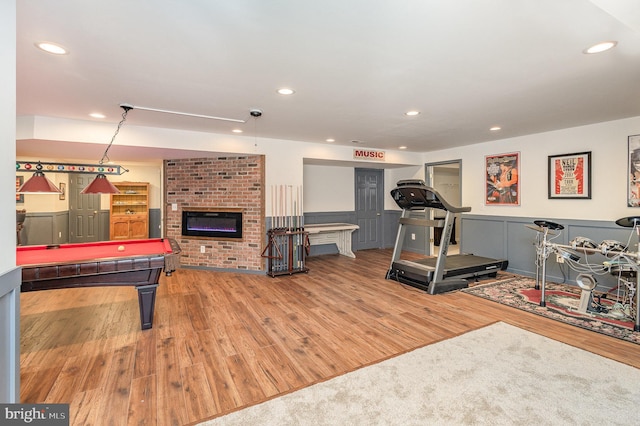 recreation room featuring wood finished floors, a fireplace, pool table, and recessed lighting