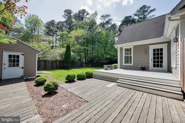 wooden terrace with view of scattered trees