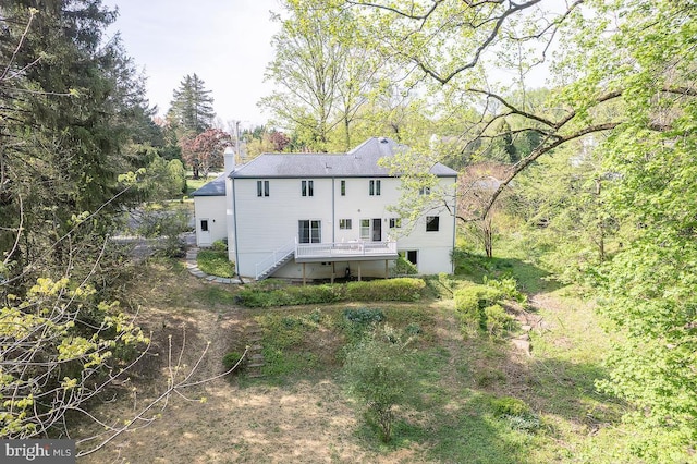 rear view of property with a chimney
