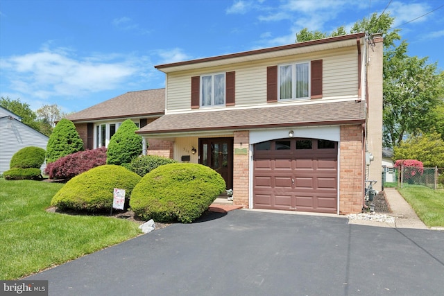 315 Waverly Rd, Southampton, PA 18966 - tri-level home featuring fence, driveway, a shingled roof, and brick siding