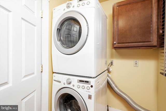 221 Orchard Ave, Burlington, NJ 08016 - washroom with cabinet space and stacked washer / dryer