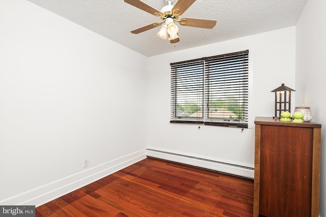 221 Orchard Ave, Burlington, NJ 08016 - spare room featuring a ceiling fan, wood finished floors, baseboards, a textured ceiling, and a baseboard radiator