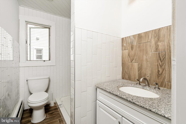 221 Orchard Ave, Burlington, NJ 08016 - bathroom featuring vanity, wood finished floors, toilet, tile walls, and baseboard heating
