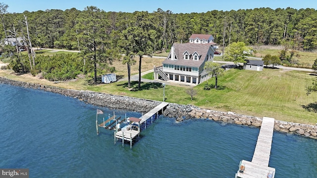 bird's eye view with a water view and a forest view