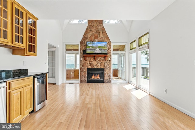 40461 Old Breton Beach Rd, Leonardtown, MD 20650 - kitchen with beverage cooler, healthy amount of natural light, glass insert cabinets, and high vaulted ceiling