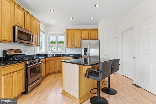 40461 Old Breton Beach Rd, Leonardtown, MD 20650 - kitchen featuring stainless steel appliances, a sink, recessed lighting, a kitchen breakfast bar, and a kitchen island