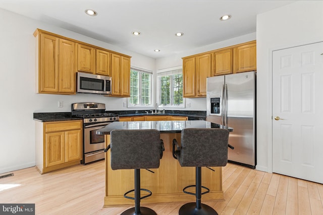 40461 Old Breton Beach Rd, Leonardtown, MD 20650 - kitchen featuring stainless steel appliances, a sink, a center island, light wood-type flooring, and recessed lighting