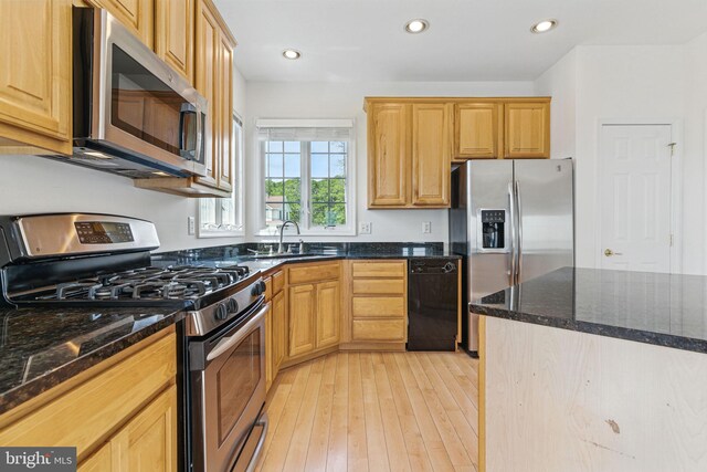 40461 Old Breton Beach Rd, Leonardtown, MD 20650 - kitchen with stainless steel appliances, a sink, light wood-style flooring, dark stone counters, and recessed lighting