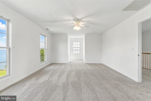 40461 Old Breton Beach Rd, Leonardtown, MD 20650 - unfurnished room featuring light carpet, ceiling fan, baseboards, and attic access