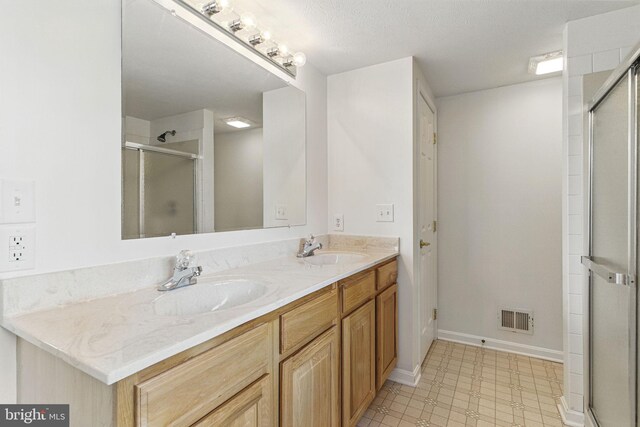 40461 Old Breton Beach Rd, Leonardtown, MD 20650 - full bath featuring a stall shower, double vanity, and baseboards