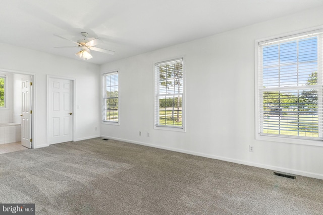 40461 Old Breton Beach Rd, Leonardtown, MD 20650 - unfurnished bedroom with carpet flooring, baseboards, ensuite bath, and ceiling fan