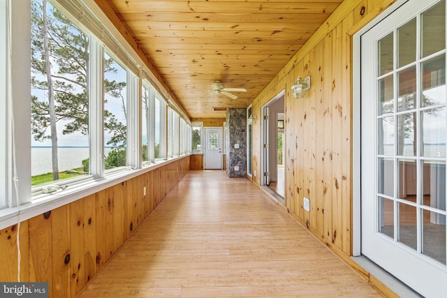 40461 Old Breton Beach Rd, Leonardtown, MD 20650 - unfurnished sunroom featuring wood walls, a water view, wood finished floors, and wood ceiling