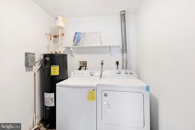 washroom with laundry area, washing machine and dryer, and water heater