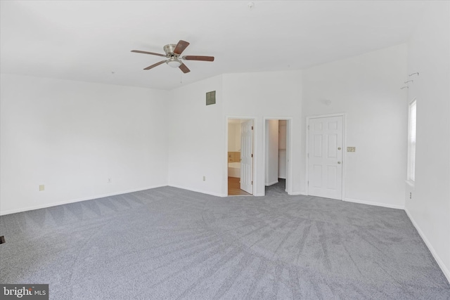 unfurnished room featuring carpet floors, baseboards, a ceiling fan, and visible vents