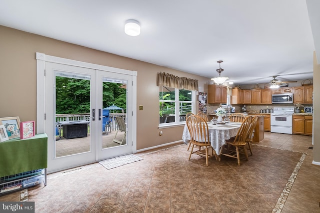 75 NW Dr, Huntingtown, MD 20639 - dining room with tile patterned floors, french doors, and baseboards