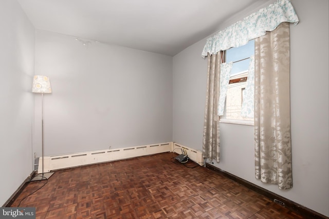 empty room with baseboards and baseboard heating