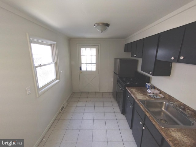 615 Lake St, Lancaster, PA 17603 - kitchen featuring a sink, gas stove, dark countertops, and visible vents