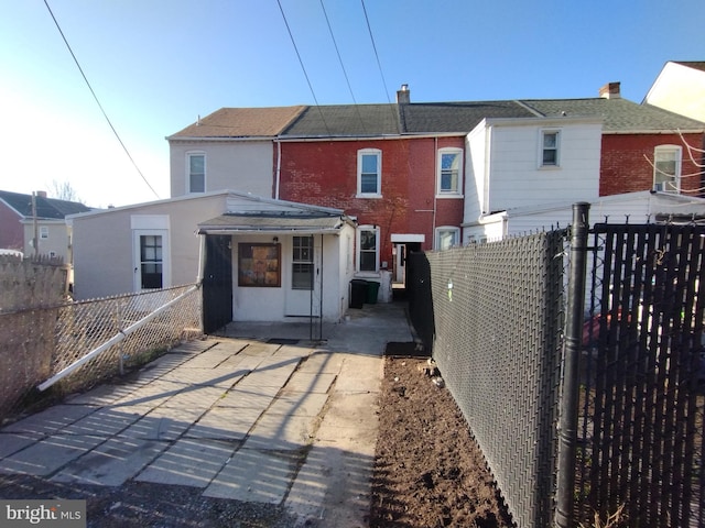 615 Lake St, Lancaster, PA 17603 - back of property featuring brick siding and a fenced backyard