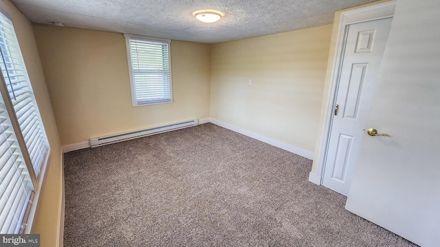 207 Spruce St, Westernport, MD 21562 - carpeted empty room featuring baseboards, a baseboard radiator, and a textured ceiling