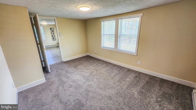 207 Spruce St, Westernport, MD 21562 - empty room with a textured ceiling, baseboards, a baseboard radiator, a baseboard heating unit, and carpet
