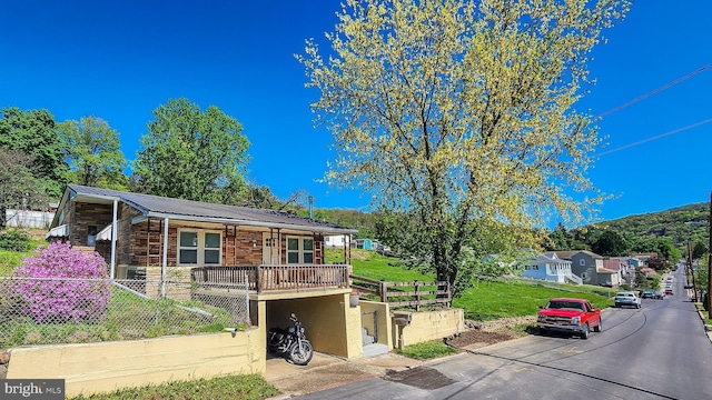 207 Spruce St, Westernport, MD 21562 - log-style house featuring fence, a front lawn, and metal roof