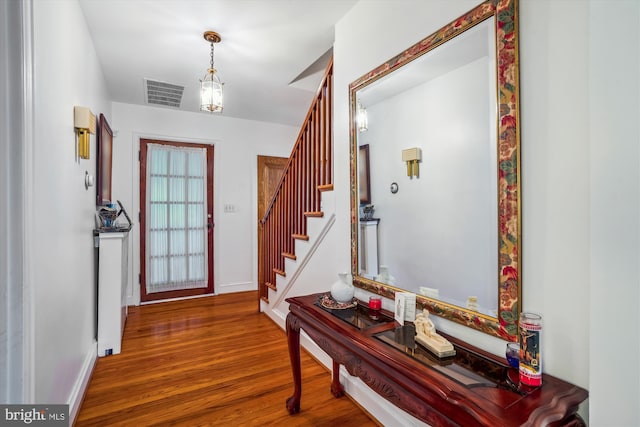 5506 39th Ave, Hyattsville, MD 20781 - foyer featuring wood finished floors, stairway, and baseboards
