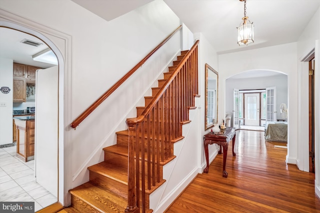 5506 39th Ave, Hyattsville, MD 20781 - stairs featuring arched walkways and wood finished floors