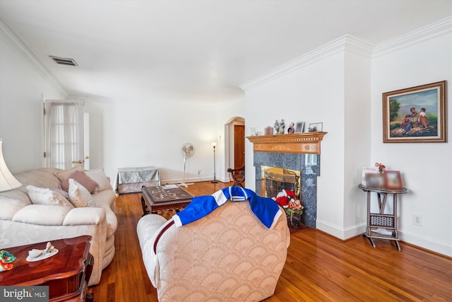 5506 39th Ave, Hyattsville, MD 20781 - living area with wood finished floors, arched walkways, a high end fireplace, crown molding, and baseboards