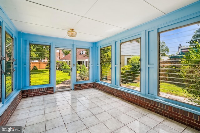 5506 39th Ave, Hyattsville, MD 20781 - unfurnished sunroom featuring brick wall and tile patterned floors