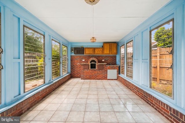 5506 39th Ave, Hyattsville, MD 20781 - unfurnished sunroom with brick wall and tile patterned flooring