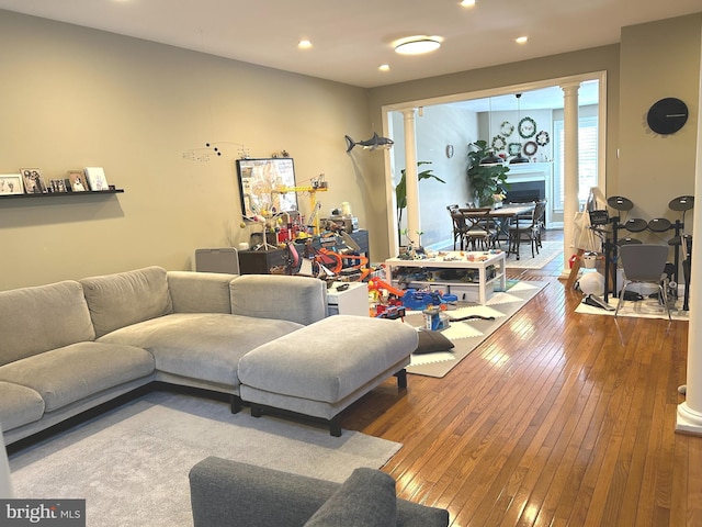 living room featuring recessed lighting and hardwood / wood-style flooring