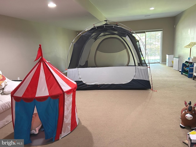 carpeted bedroom featuring recessed lighting