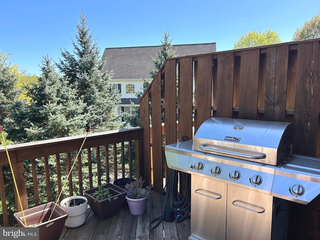 wooden deck featuring grilling area