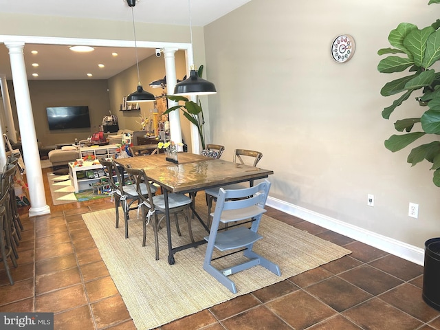 tiled dining area featuring ornate columns, recessed lighting, and baseboards