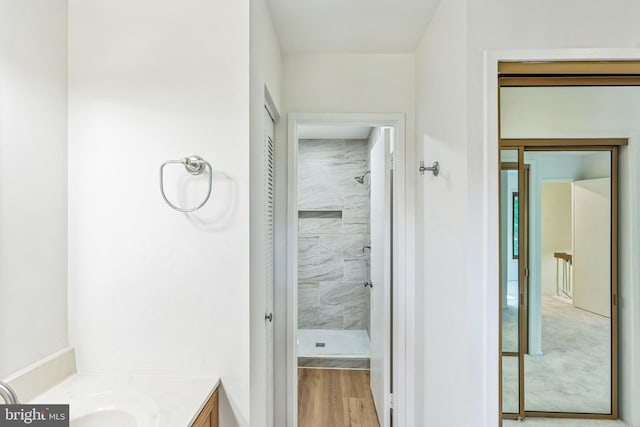 20003 Hob Hill Way, Gaithersburg, MD 20886 - bathroom with vanity, tiled shower, and wood finished floors