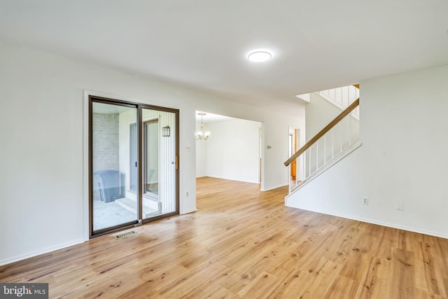 20003 Hob Hill Way, Gaithersburg, MD 20886 - spare room featuring a chandelier, light wood-style flooring, and stairway